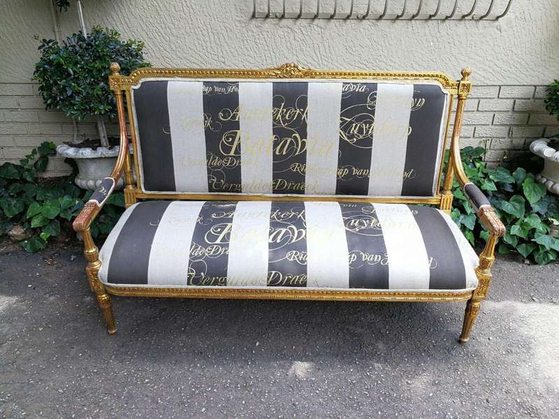 A 20th Century French Style Ornate Hand-Carved and Gilded Settee / Sofa Upholstered in a Custom-m...