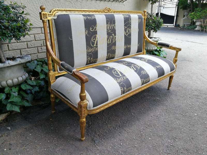 A 20th Century French Style Ornate Hand-Carved and Gilded Settee / Sofa Upholstered in a Custom-m...