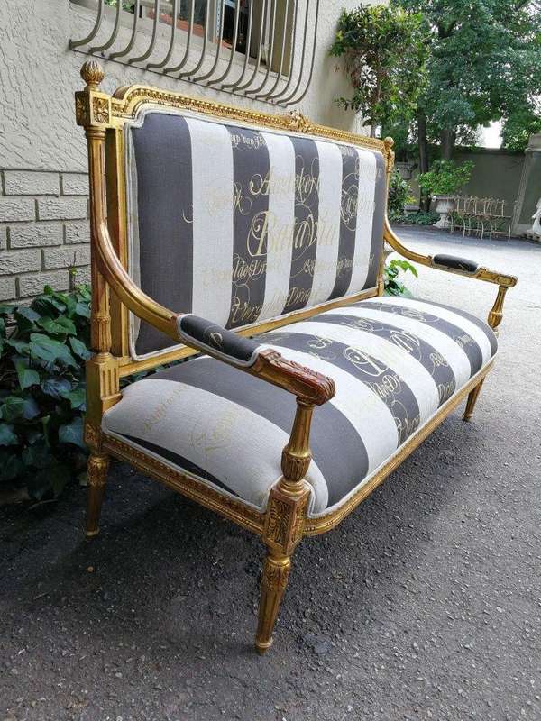 A 20th Century French Style Ornate Hand-Carved and Gilded Settee / Sofa Upholstered in a Custom-m...
