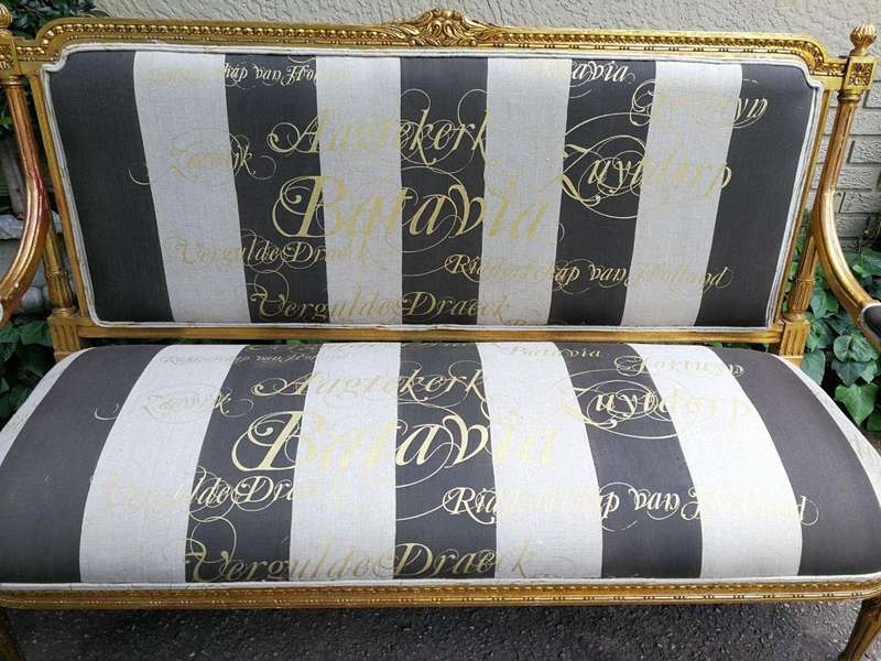 A 20th Century French Style Ornate Hand-Carved and Gilded Settee / Sofa Upholstered in a Custom-m...