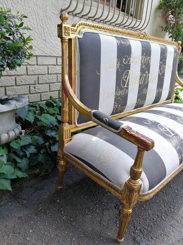 A 20th Century French Style Ornate Hand-Carved and Gilded Settee / Sofa Upholstered in a Custom-m...