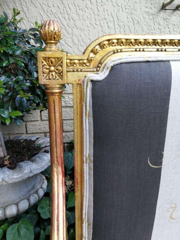 A 20th Century French Style Ornate Hand-Carved and Gilded Settee / Sofa Upholstered in a Custom-m...