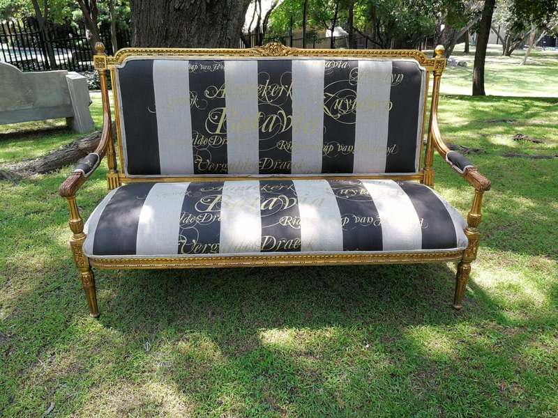 A 20th Century French Style Ornate Hand-Carved and Gilded Settee / Sofa Upholstered in a Custom-m...