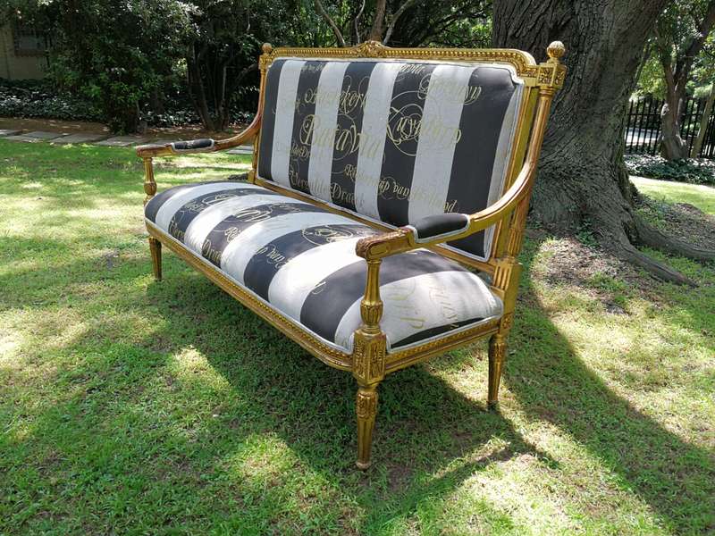 A 20th Century French Style Ornate Hand-Carved and Gilded Settee / Sofa Upholstered in a Custom-m...