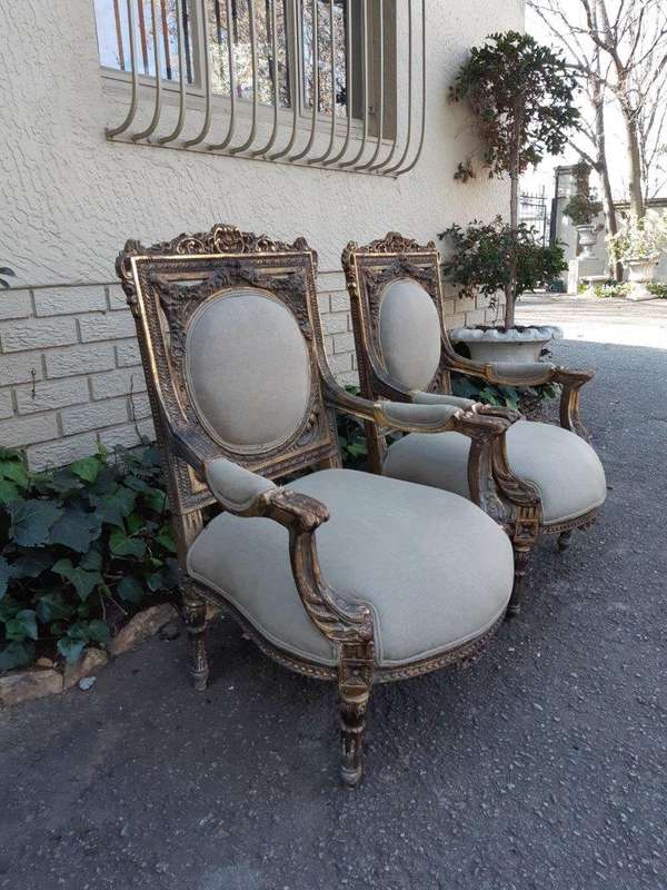 A 20th Century Pair (over 80 years old) of French Style Ornately Carved and Gilded Arm Chairs Uph...