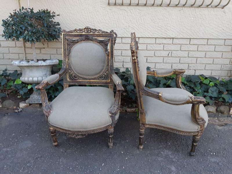 A 20th Century Pair (over 80 years old) of French Style Ornately Carved and Gilded Arm Chairs Uph...