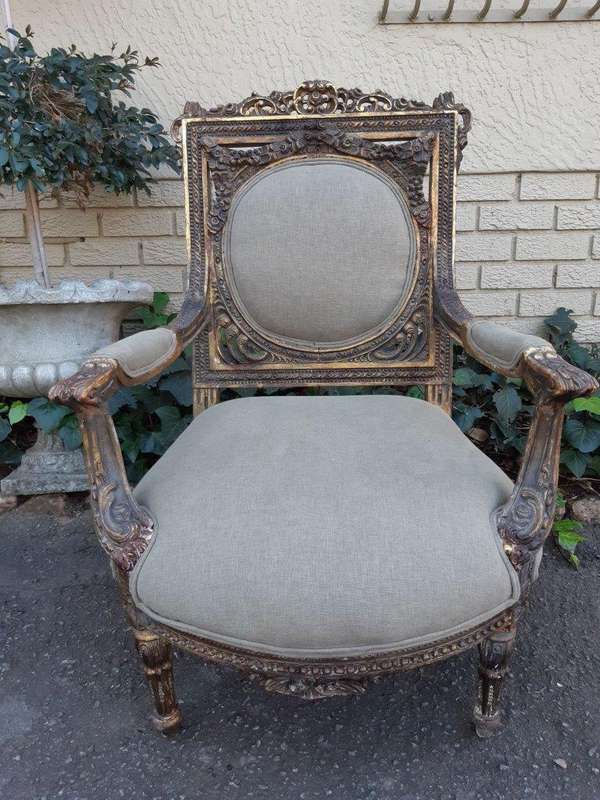 A 20th Century Pair (over 80 years old) of French Style Ornately Carved and Gilded Arm Chairs Uph...