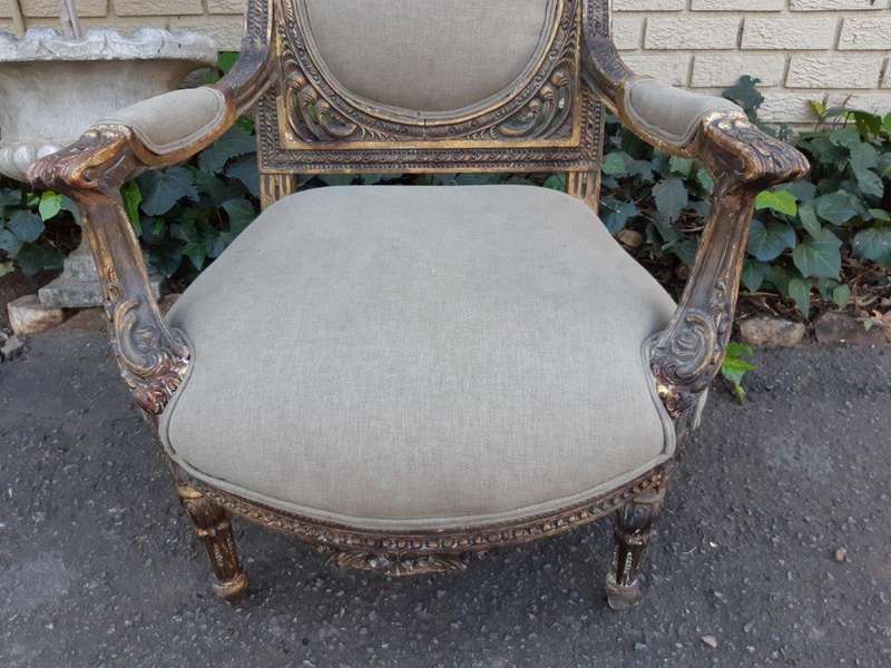 A 20th Century Pair (over 80 years old) of French Style Ornately Carved and Gilded Arm Chairs Uph...