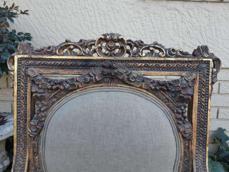 A 20th Century Pair (over 80 years old) of French Style Ornately Carved and Gilded Arm Chairs Uph...