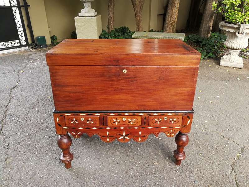 An Anglo Indian Burmese Teak Chest on Stand with Ebony Inlay. Circa 1880
