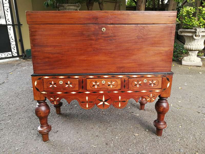 An Anglo Indian Burmese Teak Chest on Stand with Ebony Inlay. Circa 1880