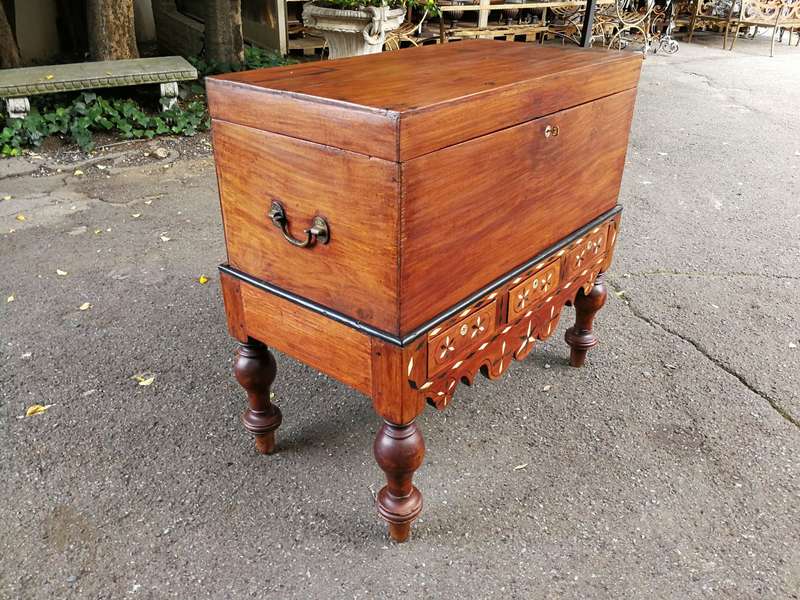 An Anglo Indian Burmese Teak Chest on Stand with Ebony Inlay. Circa 1880