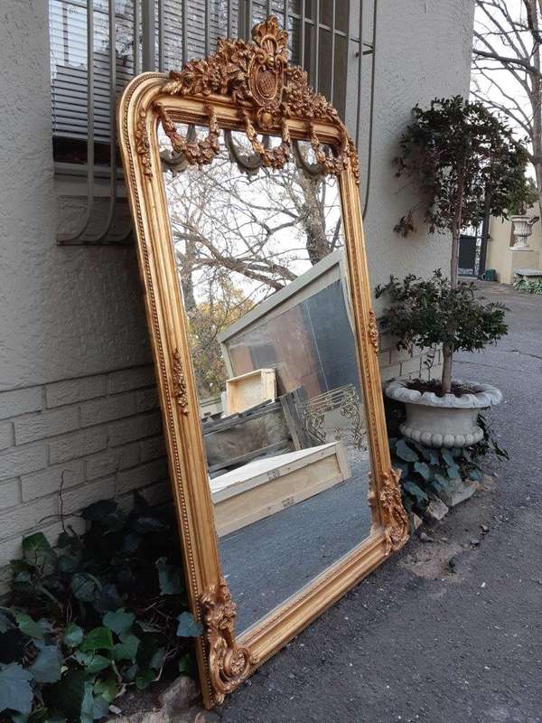 An Ornate and of Large Proportion Giltwood Bevelled Mirror