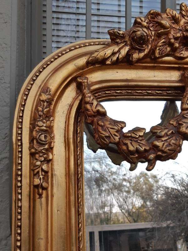 An Ornate and of Large Proportion Giltwood Bevelled Mirror