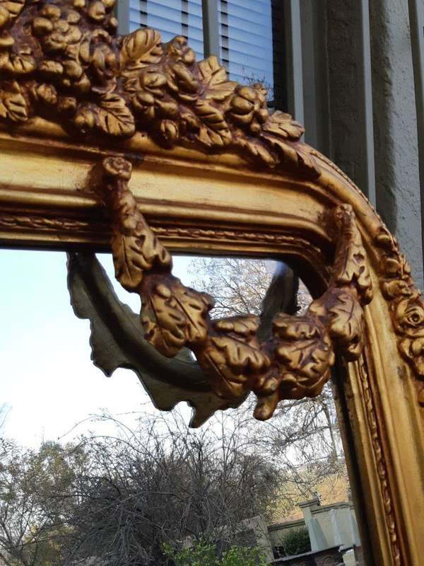 An Ornate and of Large Proportion Giltwood Bevelled Mirror