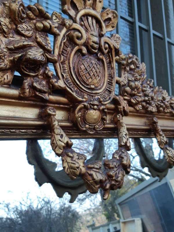 An Ornate and of Large Proportion Giltwood Bevelled Mirror