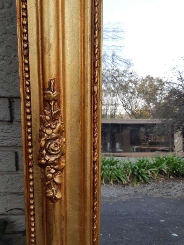An Ornate and of Large Proportion Giltwood Bevelled Mirror