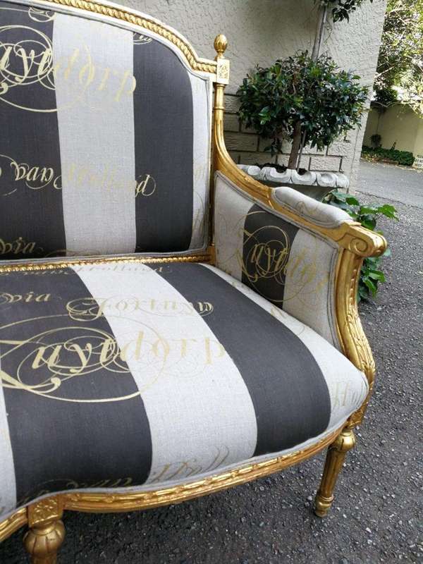 A French Antique Hand-Carved And Gilded Settee, Upholstered In A Hand Painted Imported Linen Fabr...