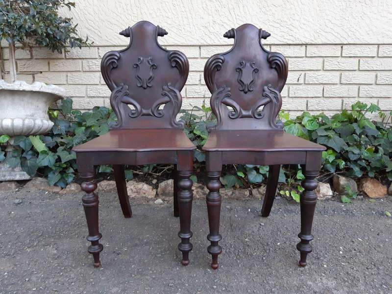 An Antique Pair Of Victorian Mahogany Oakwood Cartouche Back Chairs / Hall Chairs