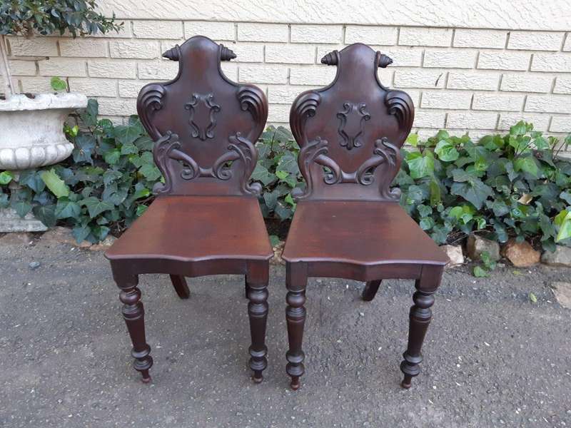 An Antique Pair Of Victorian Mahogany Oakwood Cartouche Back Chairs / Hall Chairs