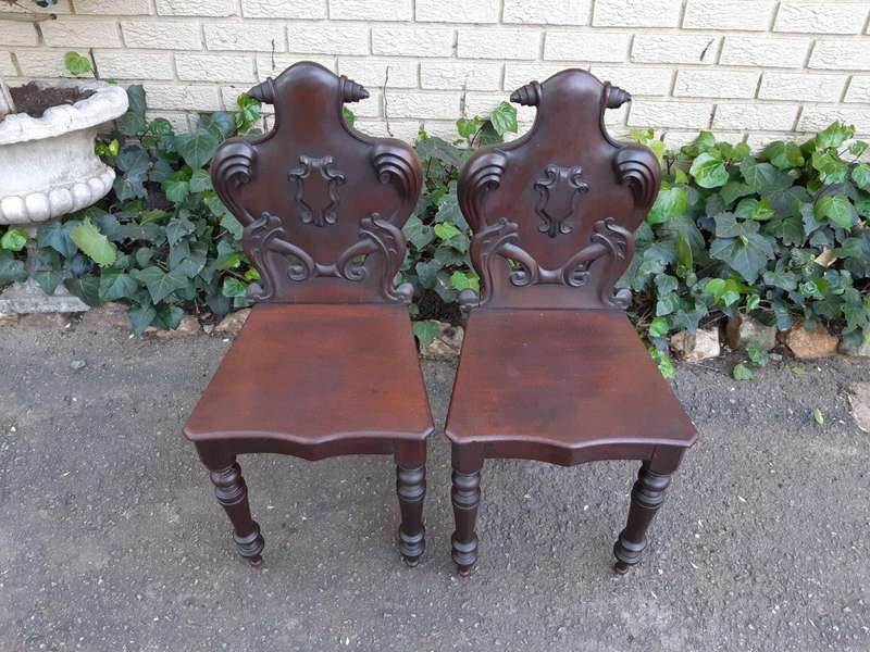 An Antique Pair Of Victorian Mahogany Oakwood Cartouche Back Chairs / Hall Chairs