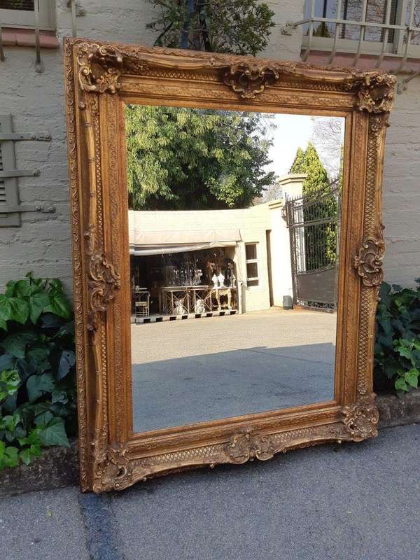 Large gilt-painted bevelled mirror