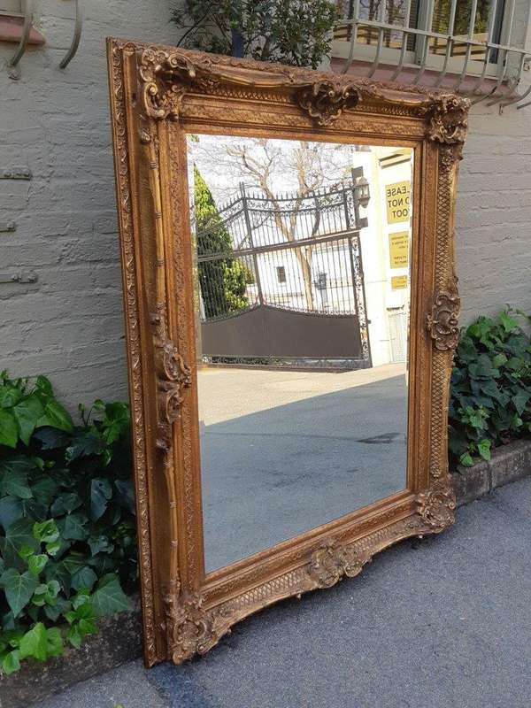 Large gilt-painted bevelled mirror