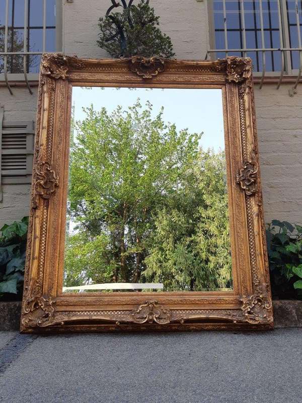 Large gilt-painted bevelled mirror