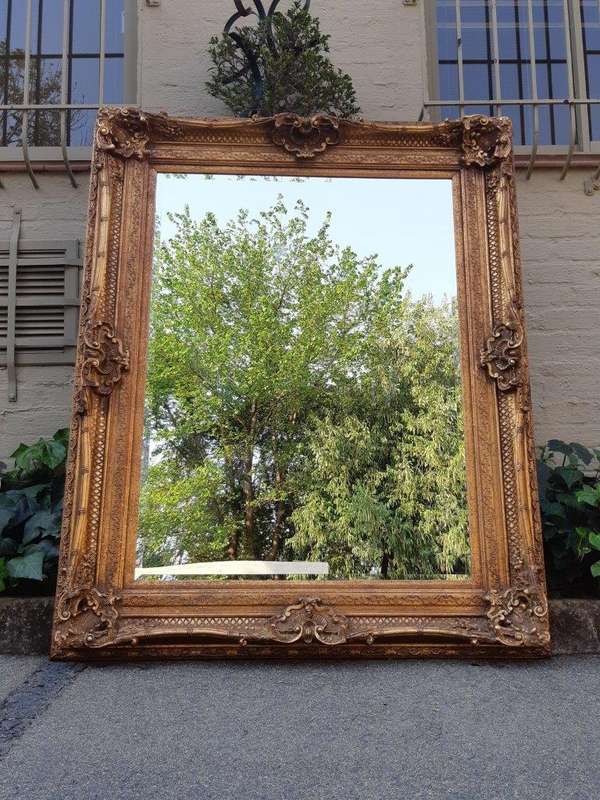 Large gilt-painted bevelled mirror