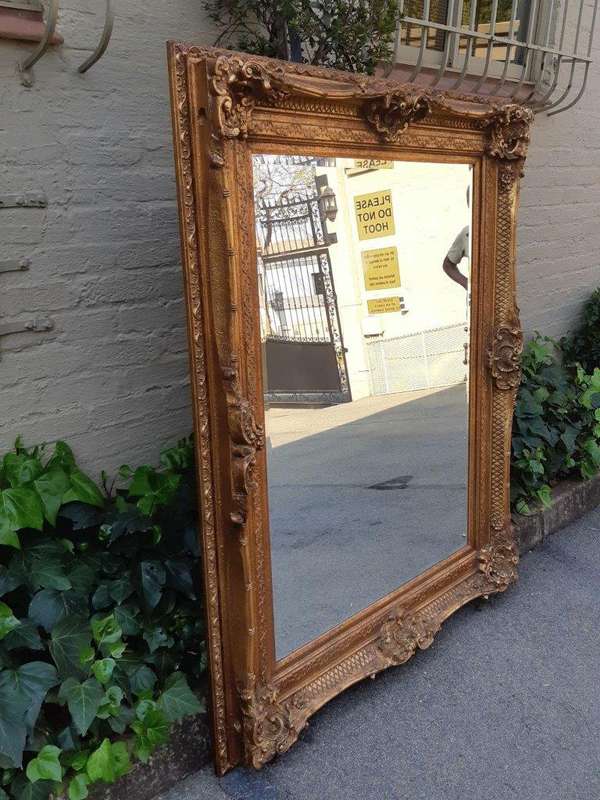 Large gilt-painted bevelled mirror