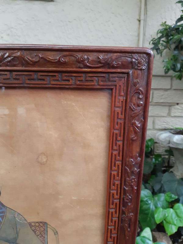 A Rare Pair of Late 19th Century Chinese Portraits on Silk in Chinese Wooden Carved Standing Frames