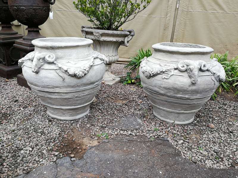 A Set of Four (4) VERY LARGE hand-painted concrete rams heads jardinieres/urns