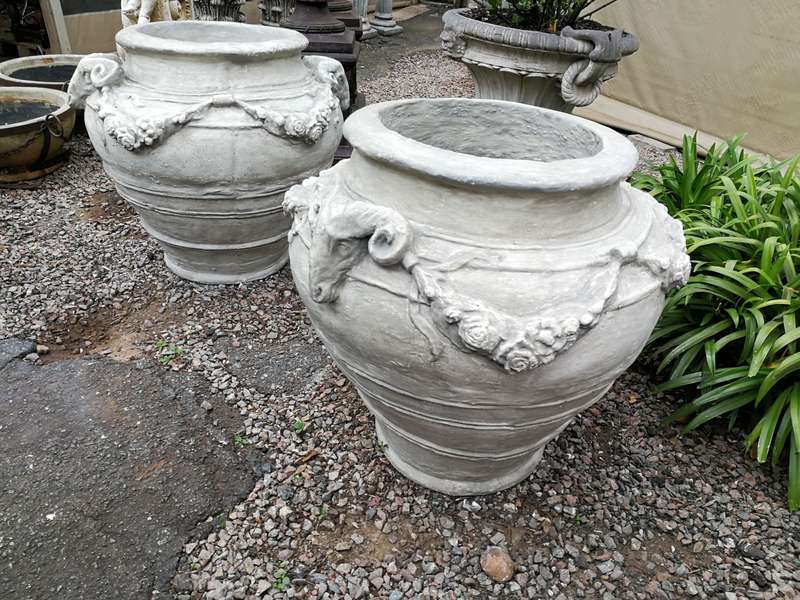 A Set of Four (4) VERY LARGE hand-painted concrete rams heads jardinieres/urns