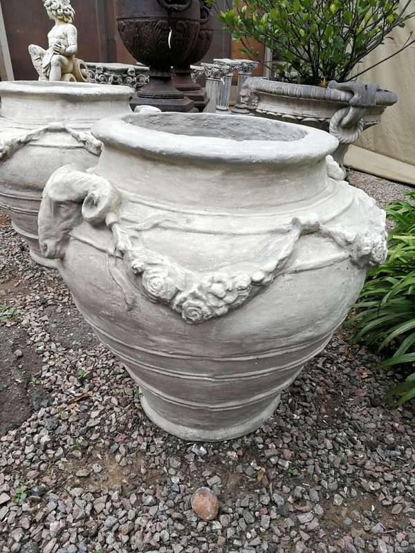 A Set of Four (4) VERY LARGE hand-painted concrete rams heads jardinieres/urns