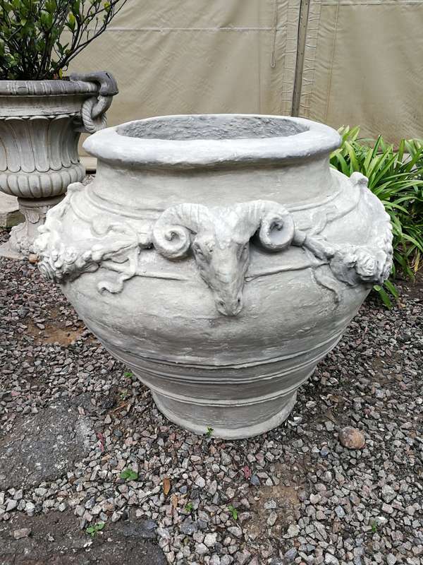 A Set of Four (4) VERY LARGE hand-painted concrete rams heads jardinieres/urns