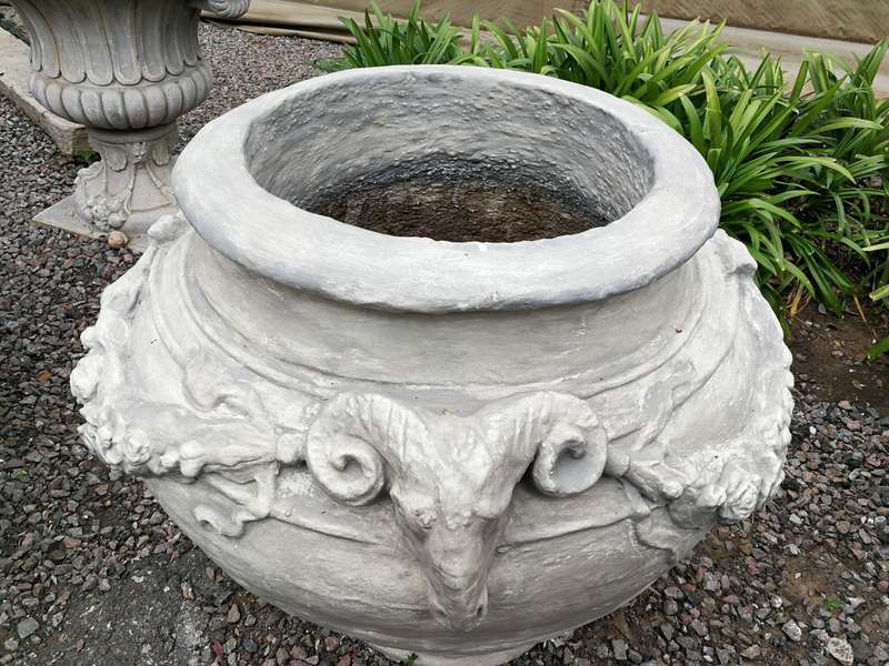A Set of Four (4) VERY LARGE hand-painted concrete rams heads jardinieres/urns