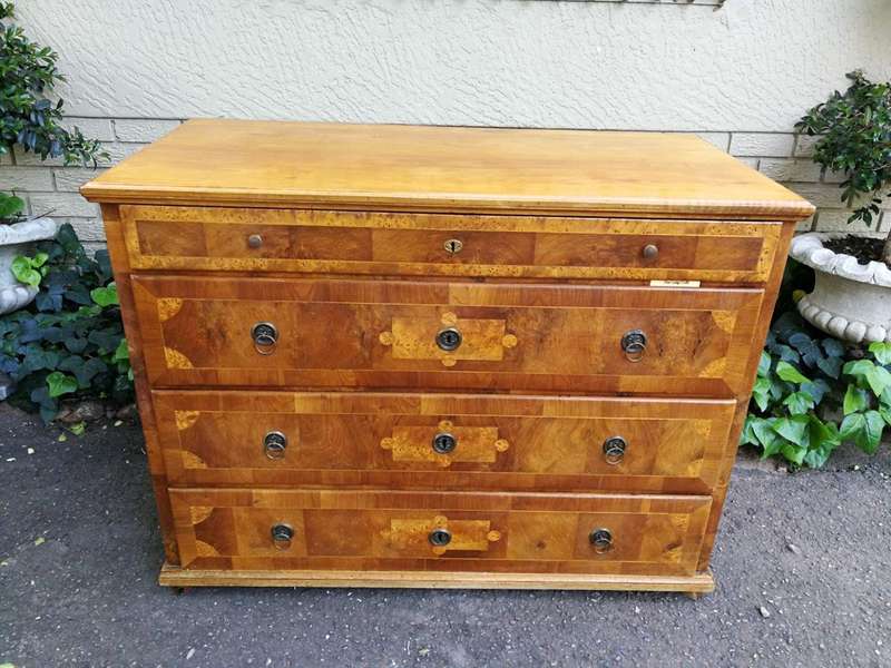 A Walnut And Inlaid Chest-Of-Drawers, 19th Century