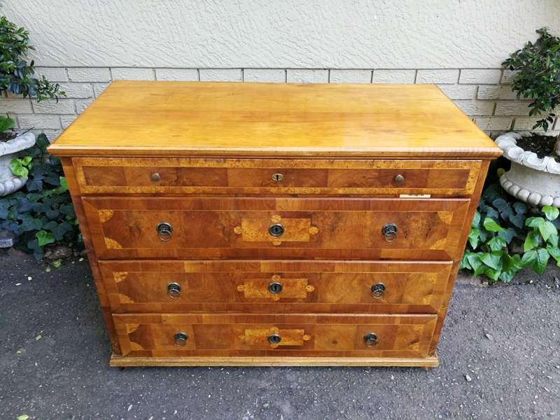 A Walnut And Inlaid Chest-Of-Drawers, 19th Century