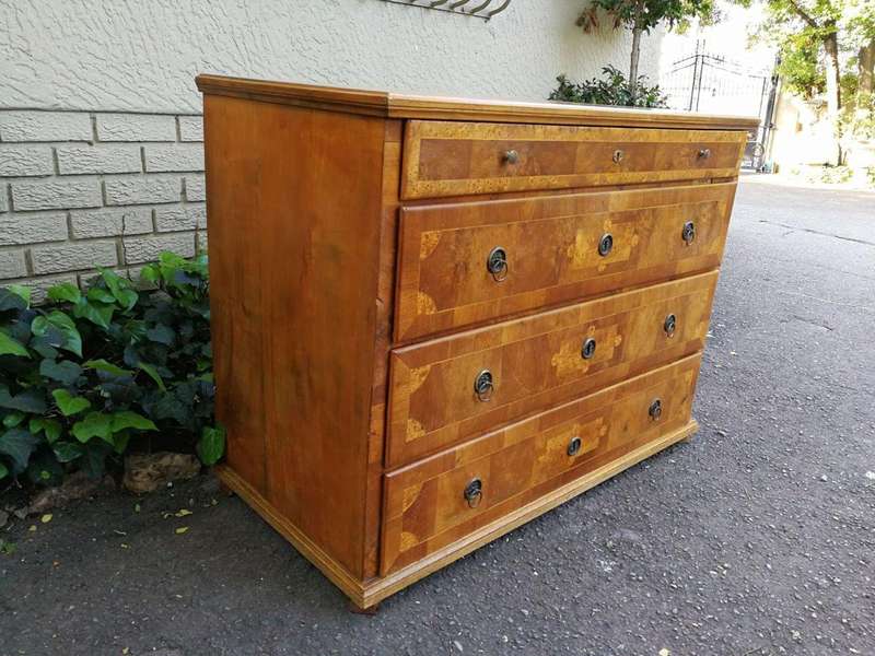 A Walnut And Inlaid Chest-Of-Drawers, 19th Century