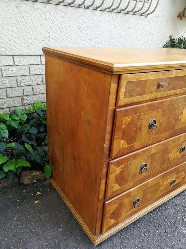 A Walnut And Inlaid Chest-Of-Drawers, 19th Century