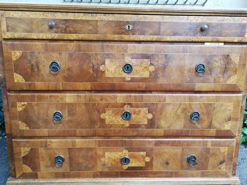 A Walnut And Inlaid Chest-Of-Drawers, 19th Century