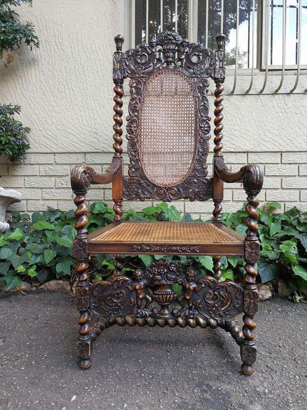 19th Century Ornately Carved Flemish Throne Chair With Rattan Back And Seat