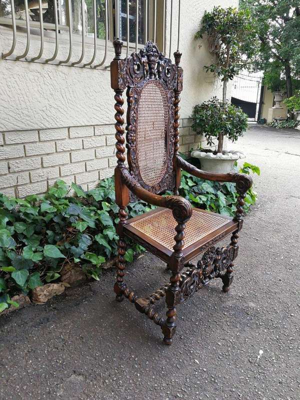 19th Century Ornately Carved Flemish Throne Chair With Rattan Back And Seat