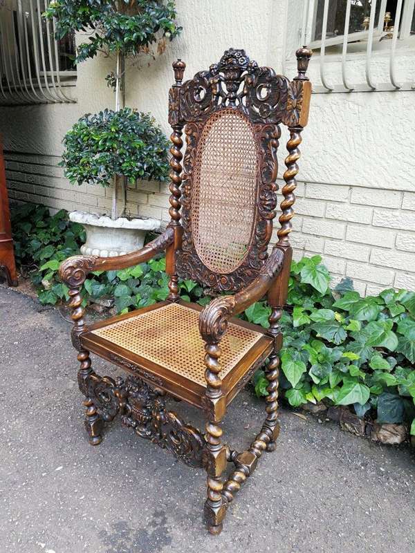 19th Century Ornately Carved Flemish Throne Chair With Rattan Back And Seat
