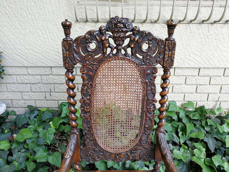 19th Century Ornately Carved Flemish Throne Chair With Rattan Back And Seat