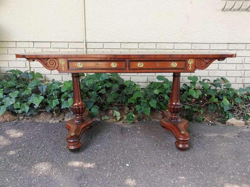 A Regency Rosewood Sofa Table With Brass Castors