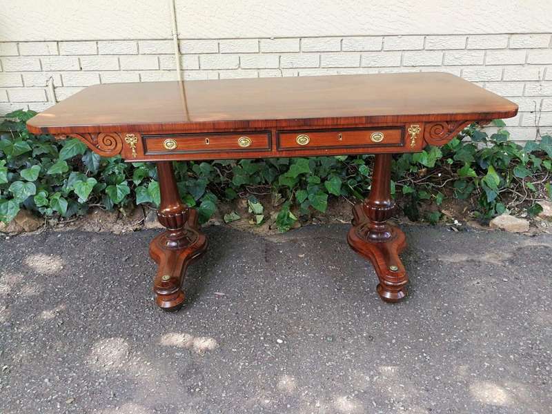 A Regency Rosewood Sofa Table With Brass Castors