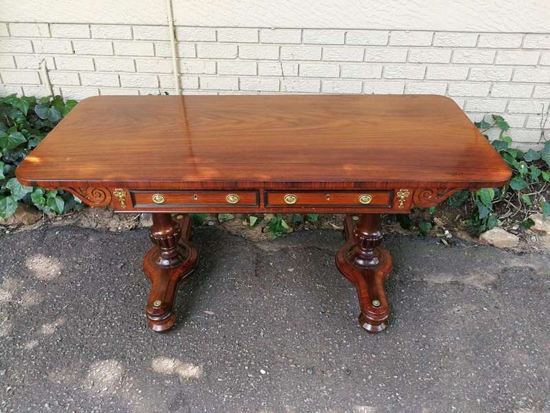 A Regency Rosewood Sofa Table With Brass Castors