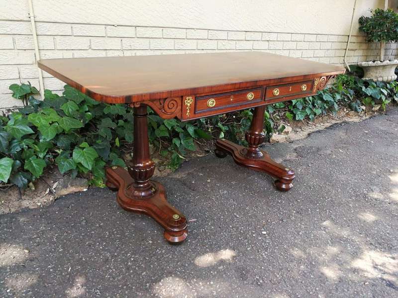 A Regency Rosewood Sofa Table With Brass Castors