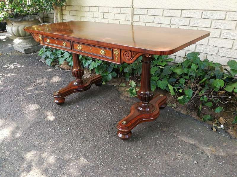 A Regency Rosewood Sofa Table With Brass Castors